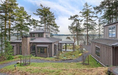 Friday Harbor Remodel view of house during the day with water in background | True Bearing Built