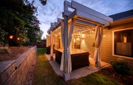 Bellingham Custom Pergola angled view from the right side with lights on | True Bearing Built